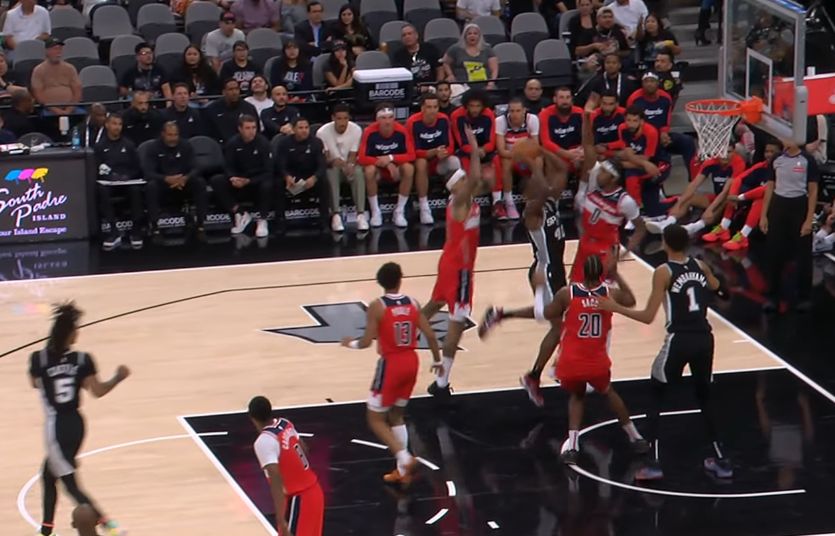 Harrison Barnes shooting with three guys on him. Also pictured: Wemby dying a little inside.