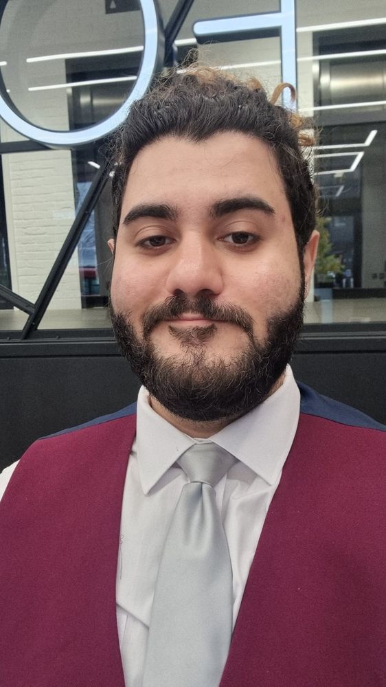 A picture of myself, with no makeup, no glasses 😭, candid, in my work uniform