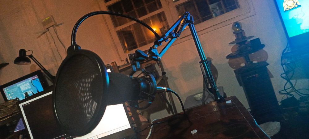 Microphone stand alongside a laptop