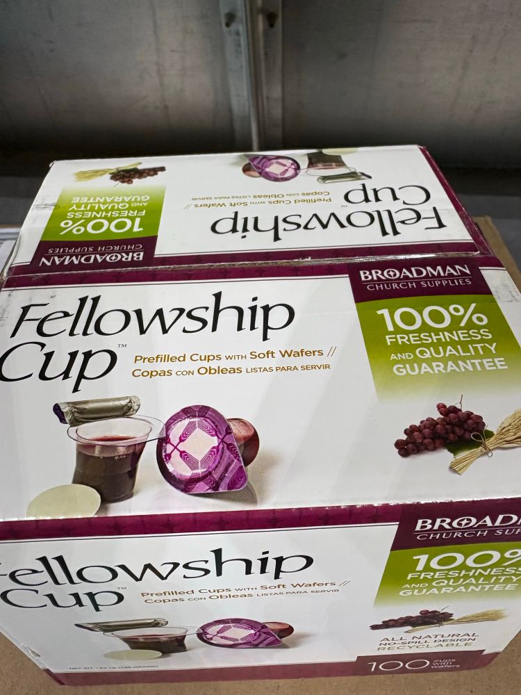 A box of “Fellowship Cups” that appear to be K-Cups for communion 