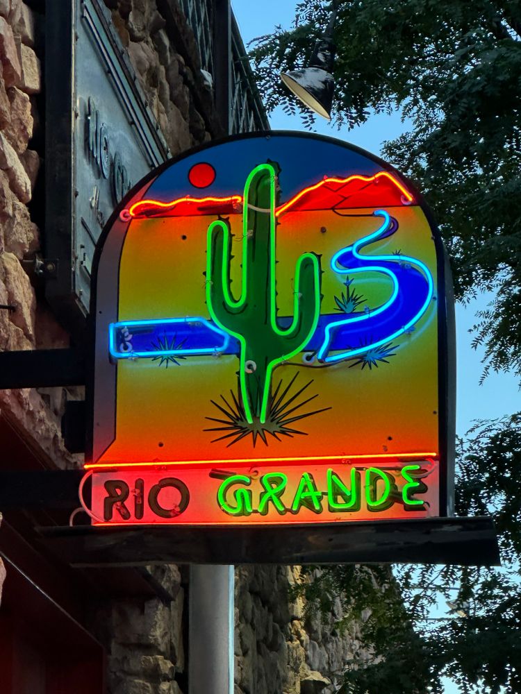 A neon sign saying Rio Grande. 