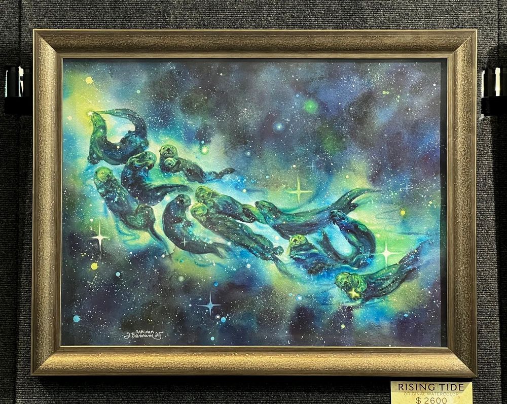 Framed watercolor of a raft of otters in a starry galaxy