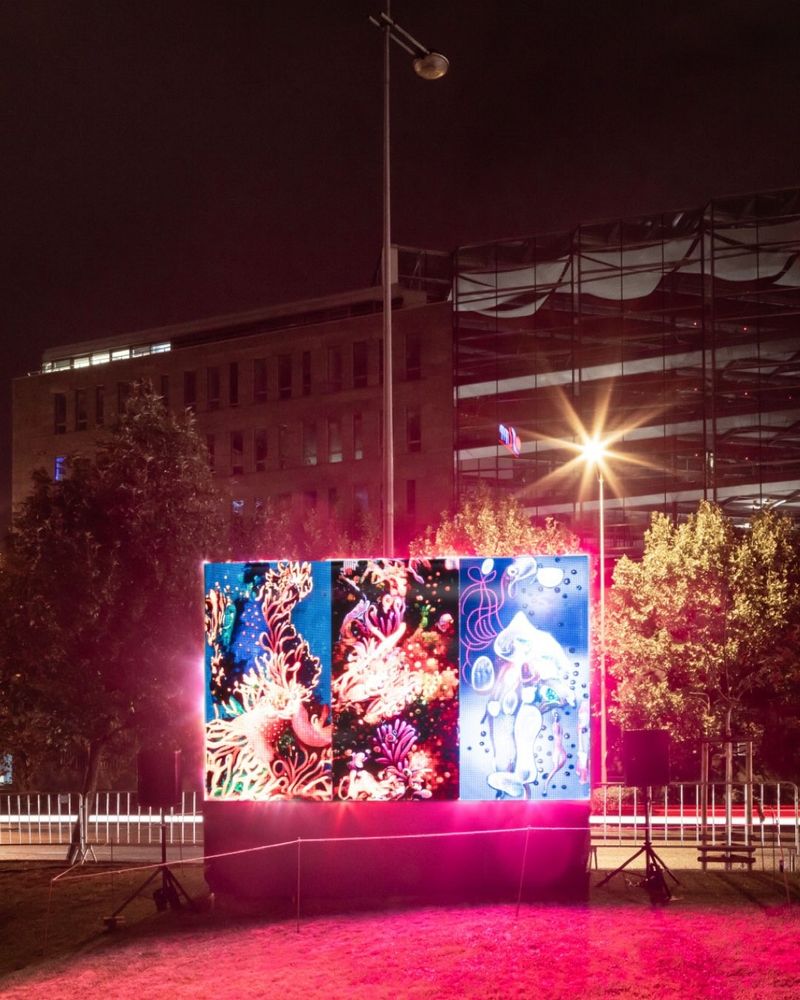 A photograph (by Thomas Slavik) of an LED display in the night, showing the work 'sediment nodes' as part of the 2023 Signal Festival.