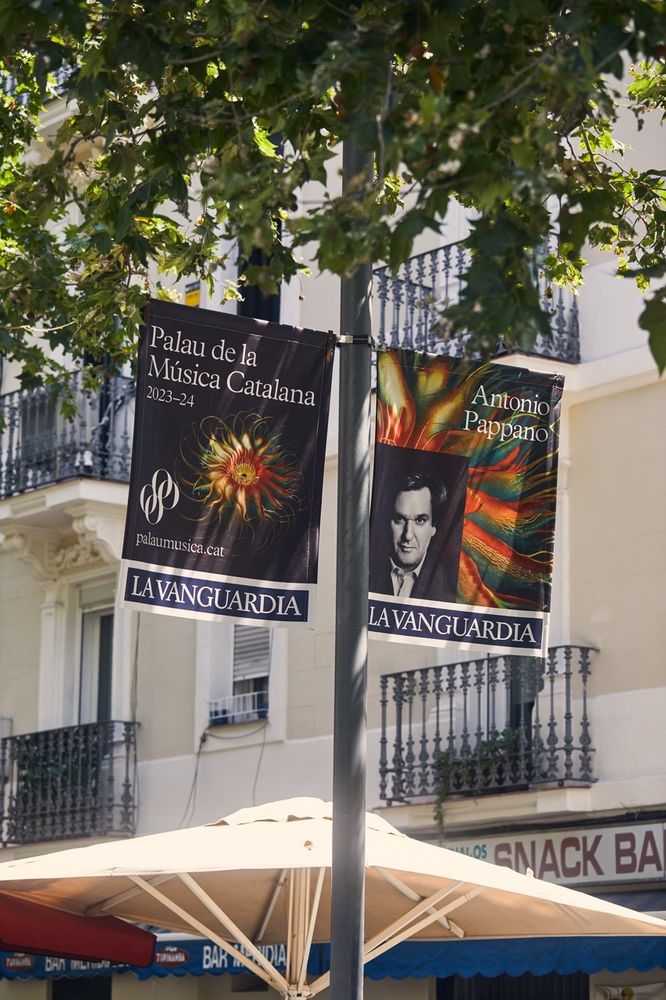 A photo showing banners in the streets of Barcelona for the seasonal program of Palau de la Música Catalana with art by Entangled Others.