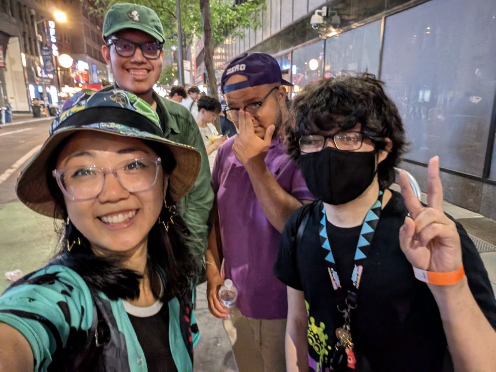 mellana, squidnick, cool and lightlazer posing for a selfie while waiting on line for the switch 2 midnight release at Nintendo NY 