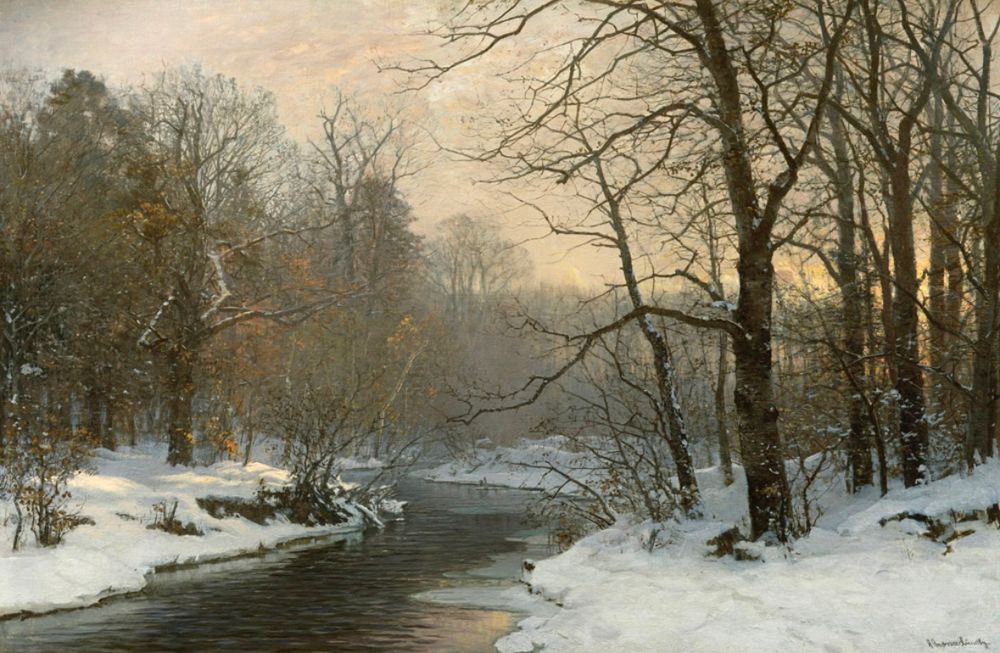 Winters day with snow on the banks of a river. 