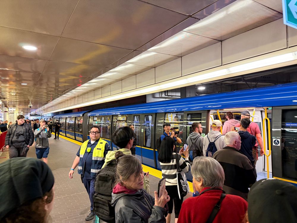 People queuing to board the new Mark 5 train