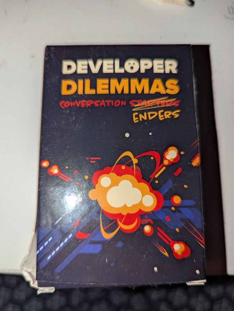 A pack of cards, labeled "developer dilemmas - conversation starters/enders" (where "starters" is strikes through)