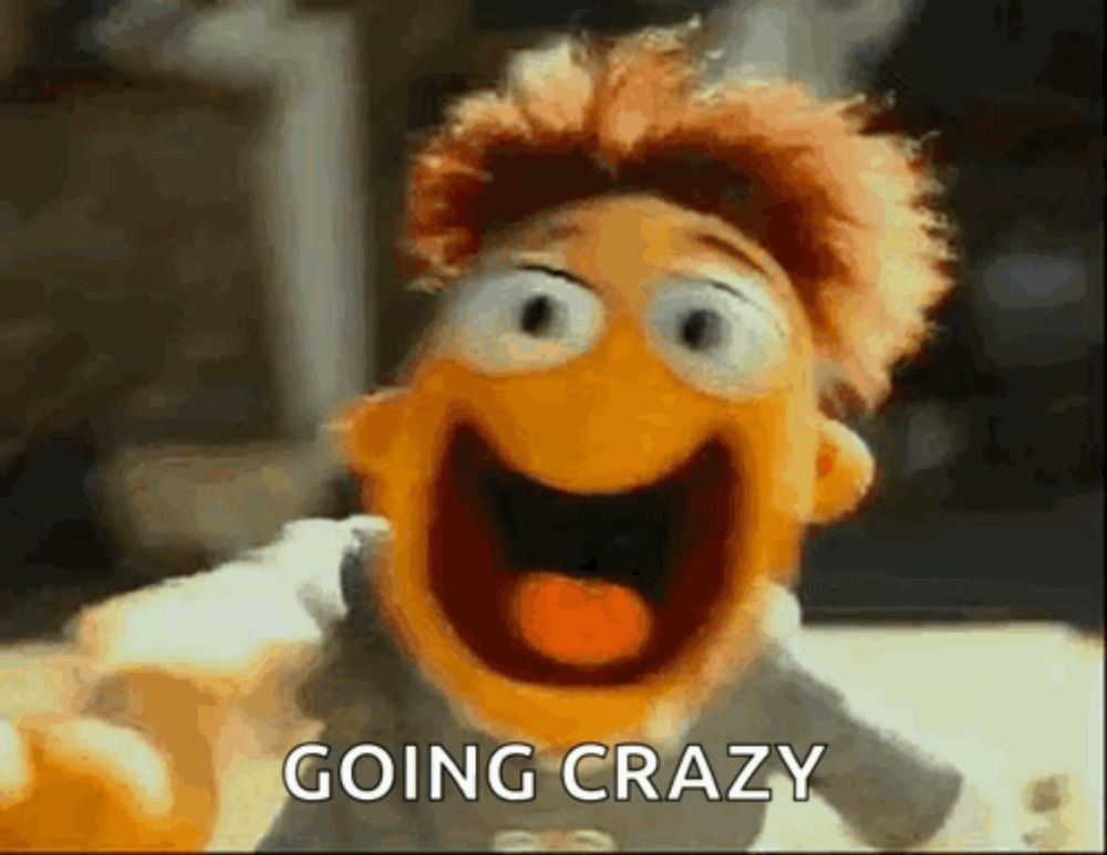 a close up of a puppet with its mouth open and the words `` going crazy '' written above it .