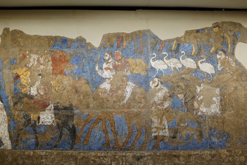 Nowrūz procession with riders on camels and horses.