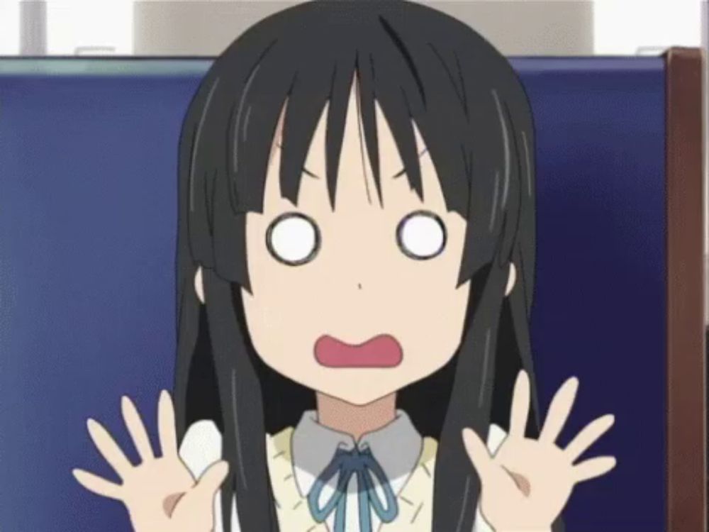 a girl with long black hair is making a surprised face with her hands up