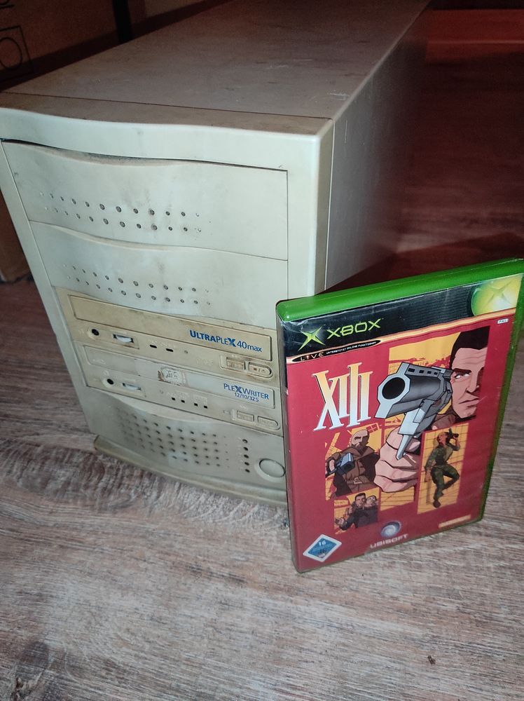 Photo of 4-slot SCSI tower with two Plextor drives installed, and a German copy of XIII for Xbox