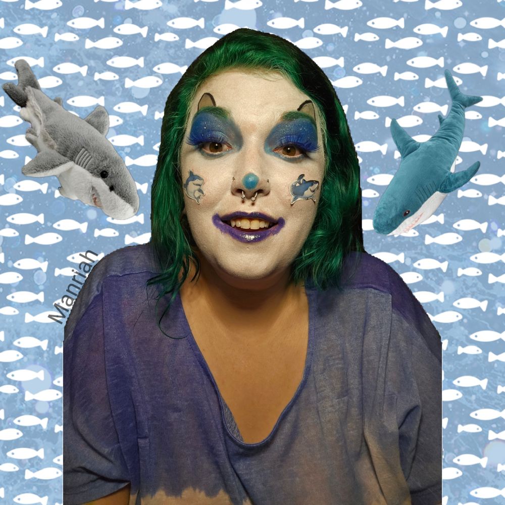 Manriah smiles wearing shark clown makeup 