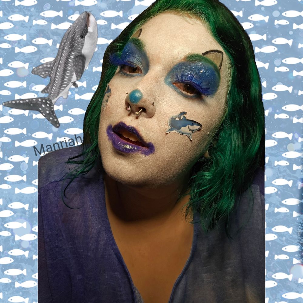 A closeup of Manriah wearing shark clown makeup 