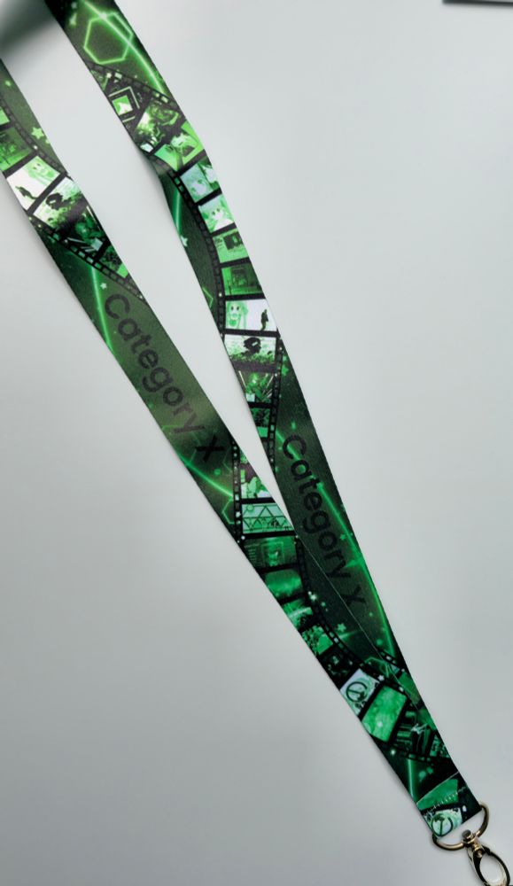 A green lanyard that says "category x" it has a film strip design with images from amvs within the strip.