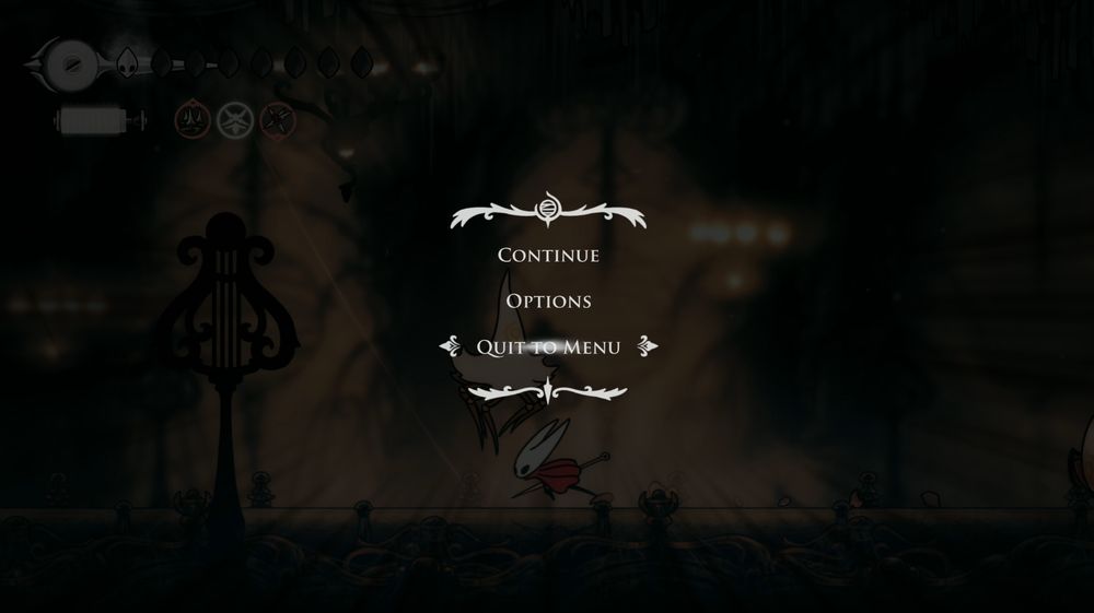 Paused Silksong screenshot of Hornet at 1 HP and half a step away from disaster, with "quit to menu" highlighted