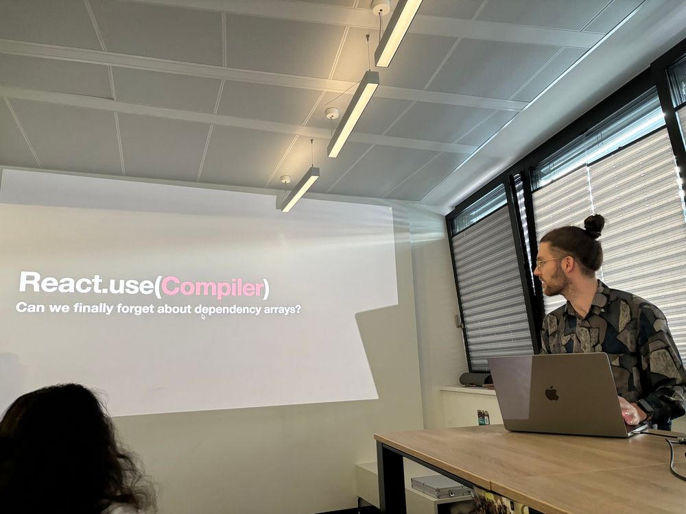 Max on stage with the slide showing the talk title: React.use(Compiler) Can we finally forget about dependency arrays?