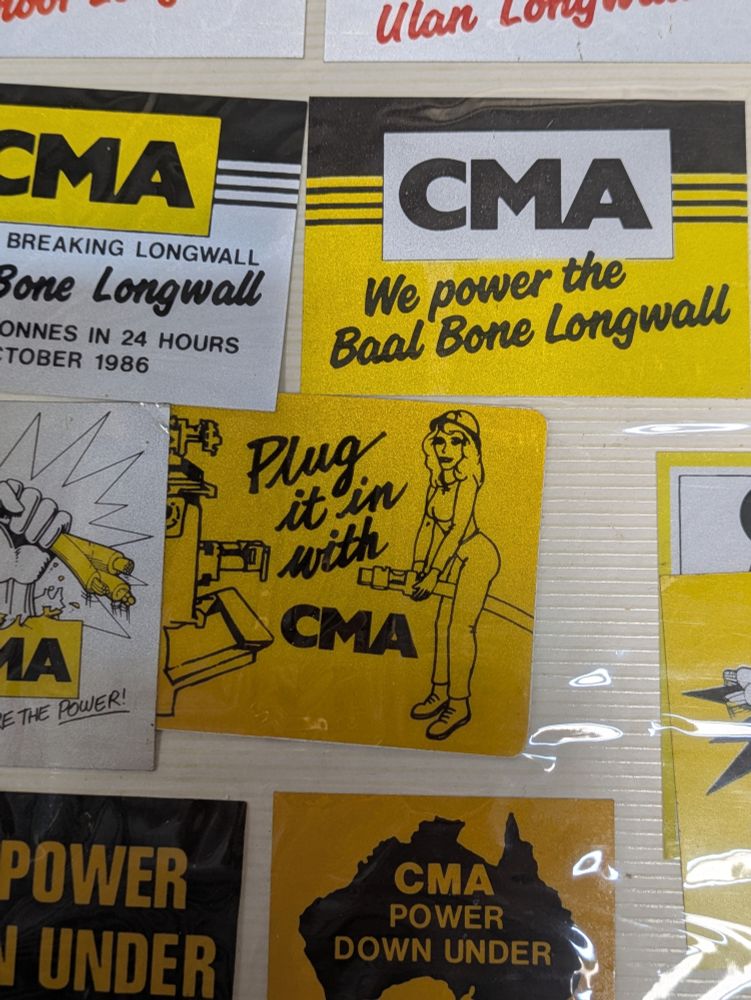 An array of "colorful" mining hard-hat and equipment stickers