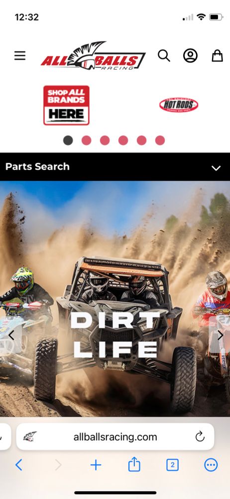 Screenshot of "all balls racing dot com" which has a wordmark at the top which says "all balls" with a banner below it with a pic of a side by side going through dirt that says "dirt life"