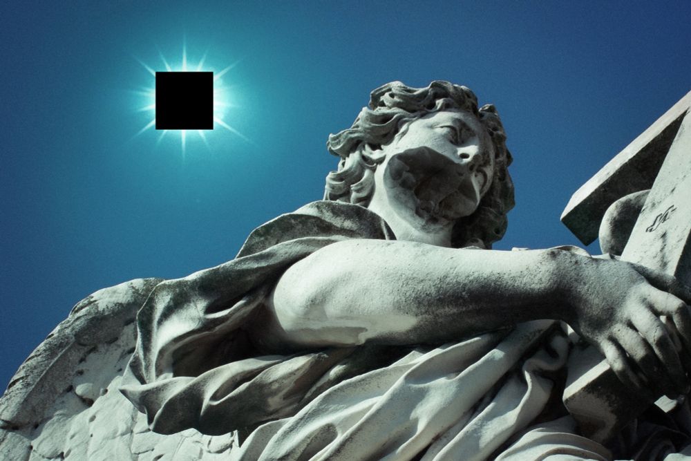 A statue of an angel. Its mouth has been chiseled away. Behind it, a clear blue sky. There is nothing in it.