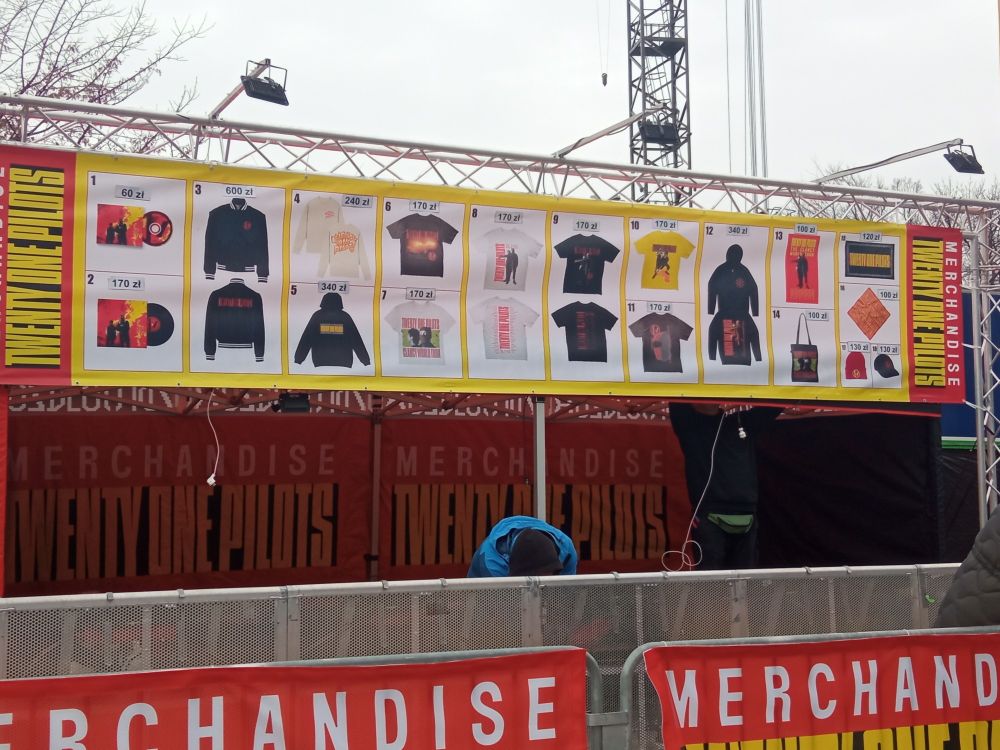 A big banner of twenty one pilots merch before clancy tour Łódź