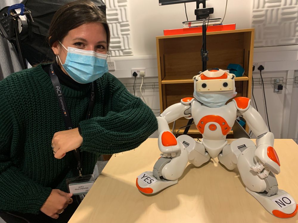 Researchers in the AFAR Lab at Cambridge University are using small robots like Nao as part of a project on how robots can help assess children's mental wellbeing. This picture, of researcher Dr Micol Spitale with Nao, was taken by PhD student Nida Itrat Abbasi.