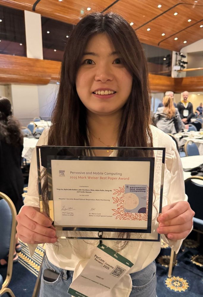 Researcher Yang Liu holds the Mark Weiser Best Paper Award, given at IEEE PerCom 2025, the International Conference on Pervasive Computing and Communications. Yang and colleagues won for their work in repurposing the in-ear microphones in our earbuds for collecting and analysing our breathing rates (a key vital sign), demonstrating a new way for us to monitor our health.