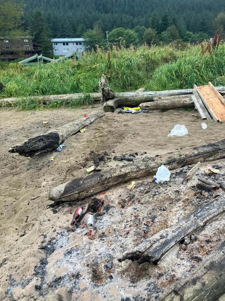 Trash and broken bottles on the beach