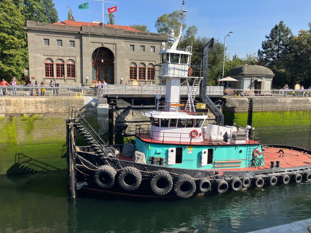 Tug passing through the big Ballard Lock