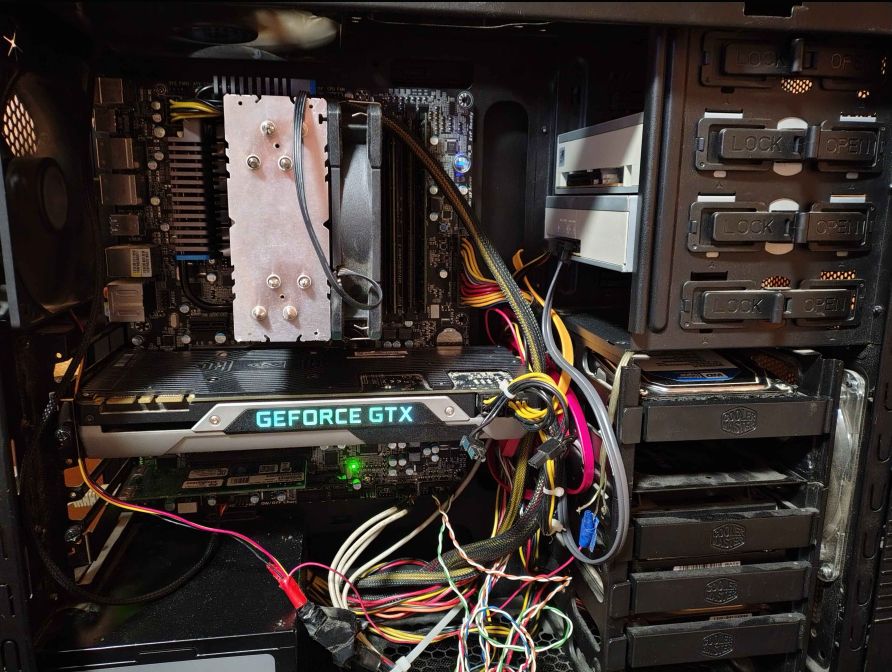 my PC in its previous case. cable management is a fuck, untangle em all 2025, I am cable monster, 410,757,864,530 cables