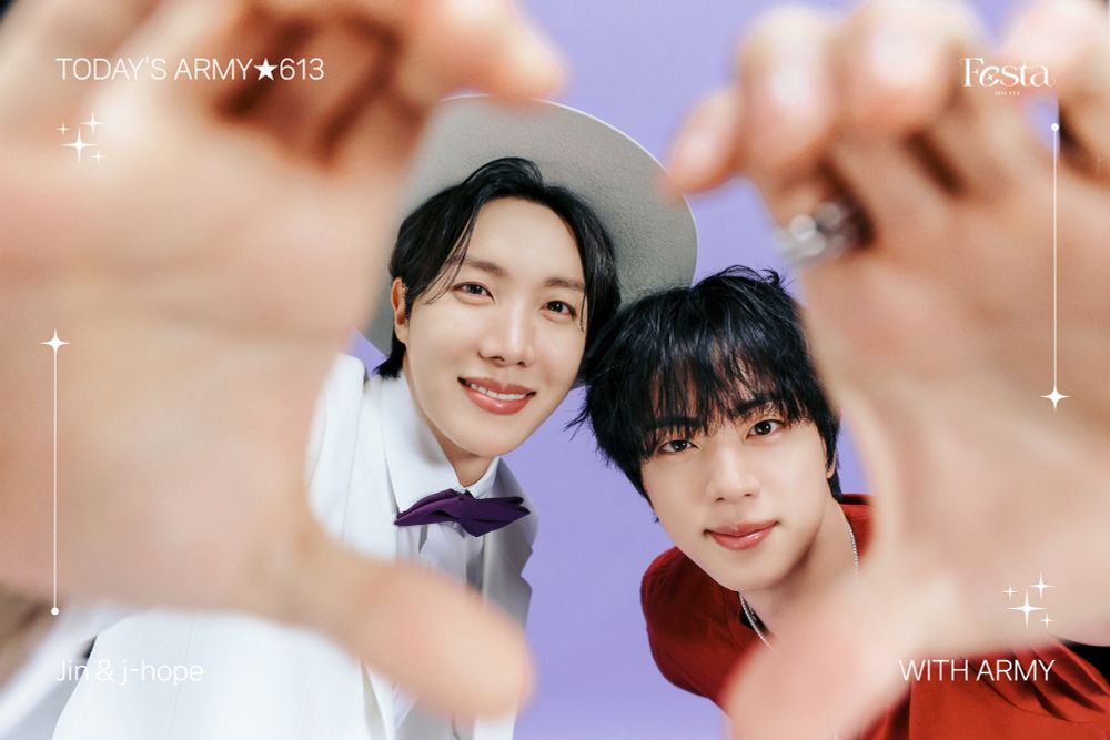 J-Hope (left side) and Jin (right side) of BTS are making a hand heart together. Their hands are in the foreground making the heart shape, and their beautiful faces are inside the heart. Hobi is wearing Jin's white suit with white brimmed hat and black bow tie design. Jin is wearing Hobi's red t-shirt design. They are smiling and look 100% adorable 💜💜💜💜💜💜💜