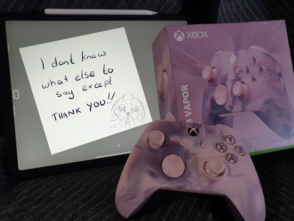 A thankyou note on an iPad that reads "I dont know what else to say, except THANKYOU!!" next to a new XBox controller