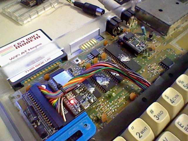 It's an opened C64 with some custom hardware. Not sure what it is but I do see a WiFi modem in the cartridge port.
