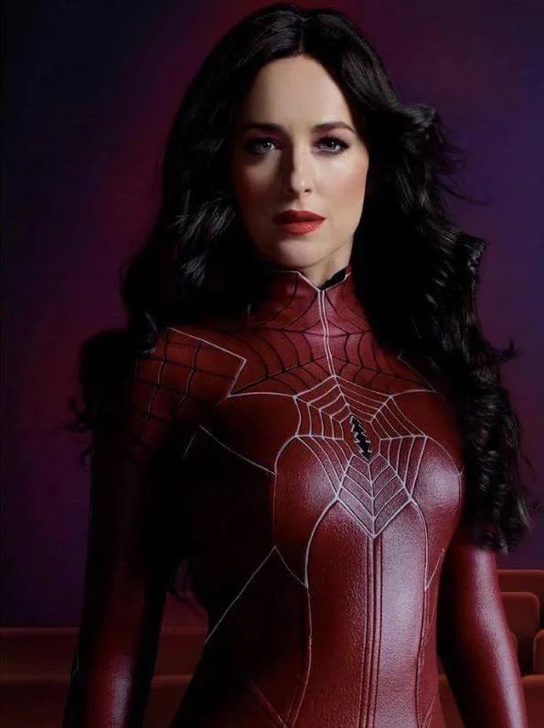 An Image of Madame Web in her iconic red costume looking forward at the camera with that look in her eyes like she knows that “Her Web Connects Us All”