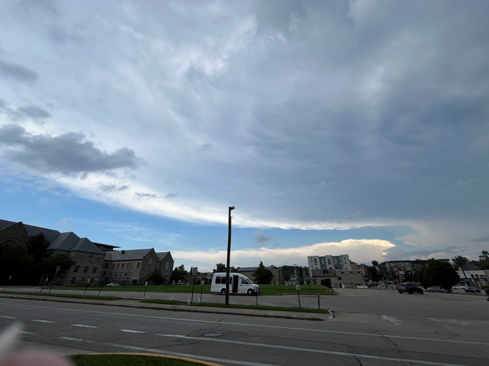 Thunderstorm anvil over a downtown scene