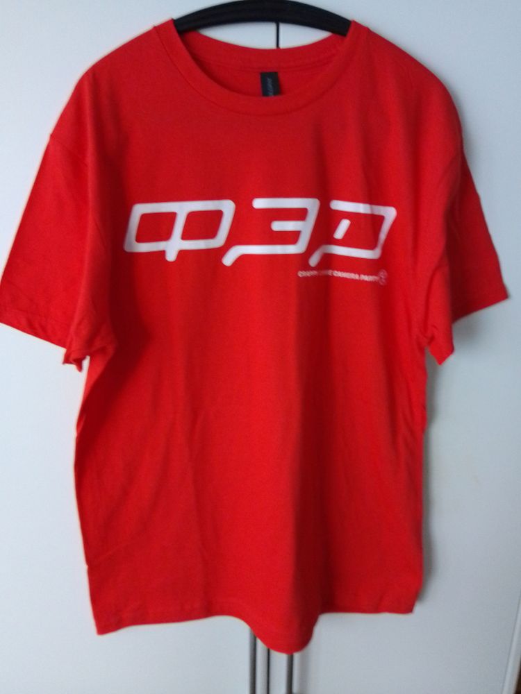A red T-shirt with a stylized FED (ФЭД) text written in Cyrillic