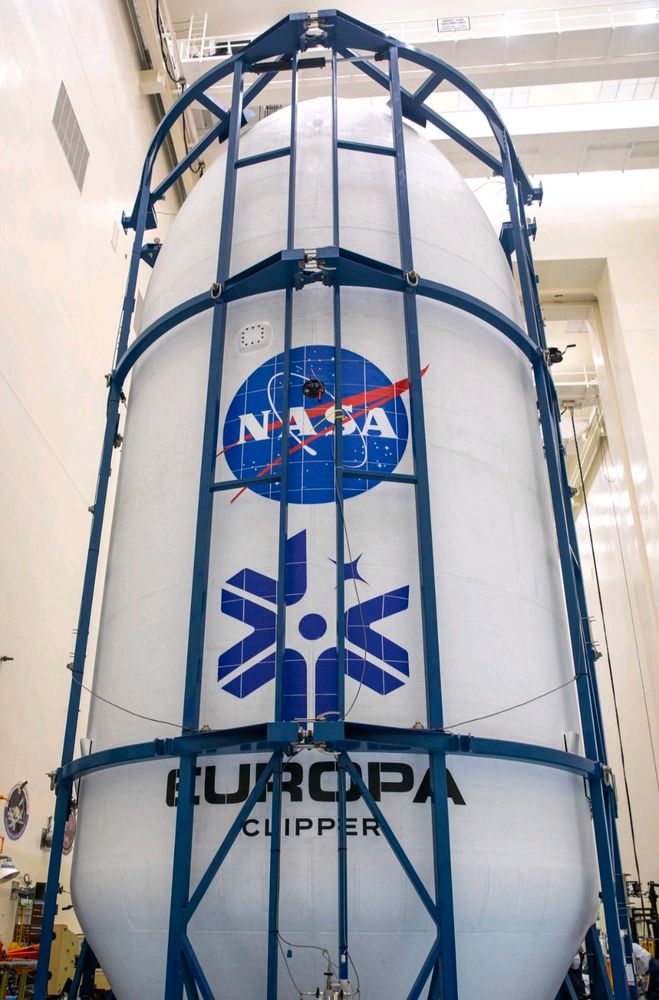 Technicians encapsulated NASA’s Europa Clipper spacecraft inside payload fairings on Wednesday, Oct. 2, 2024, in the Payload Hazardous Servicing Facility at NASA’s Kennedy Space Center in Florida. The fairings will protect the spacecraft during launch as it begins its journey to explore Jupiter’s icy moon, Europa. The mission will help scientists determine if the moon could support life. NASA and SpaceX are targeting launch at 12:31 p.m. EDT on Thursday, Oct. 10, 2024, from Launch Complex 39A at Kennedy Space Center in Florida. Photo credit: NASA/Ben Smegelsky