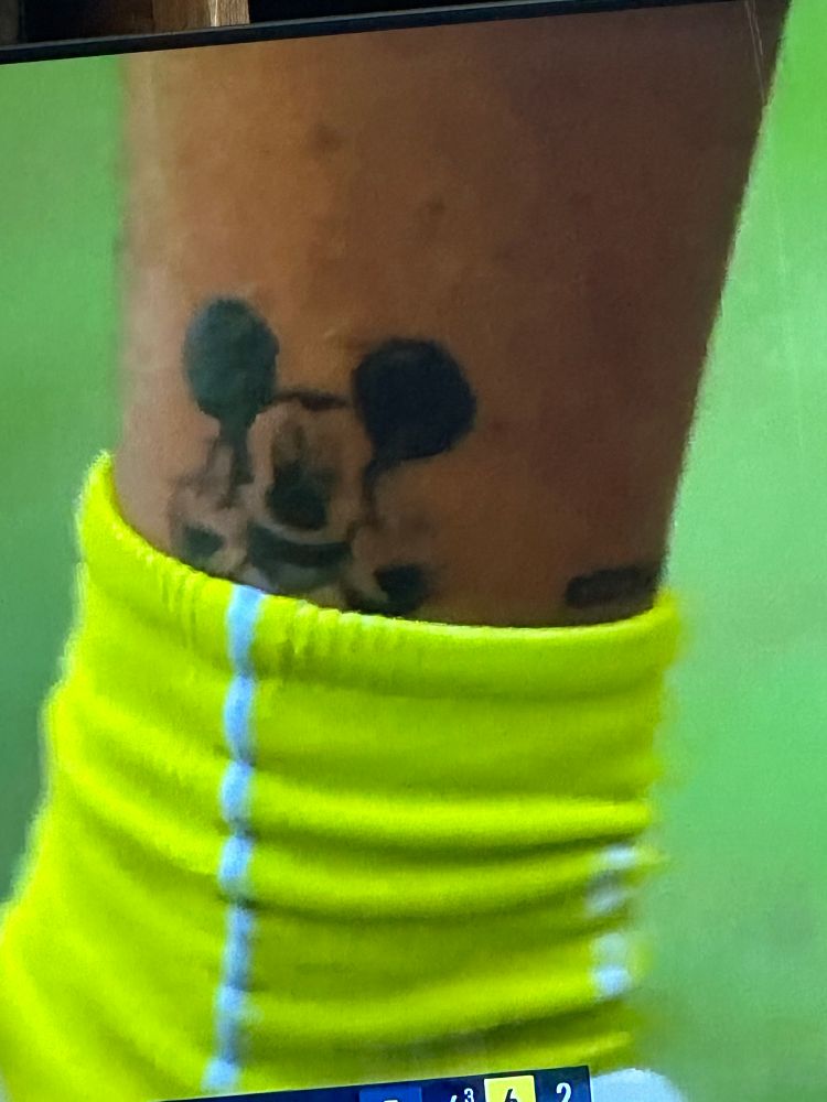 Mickey Mouse giving the finger tattoo 
