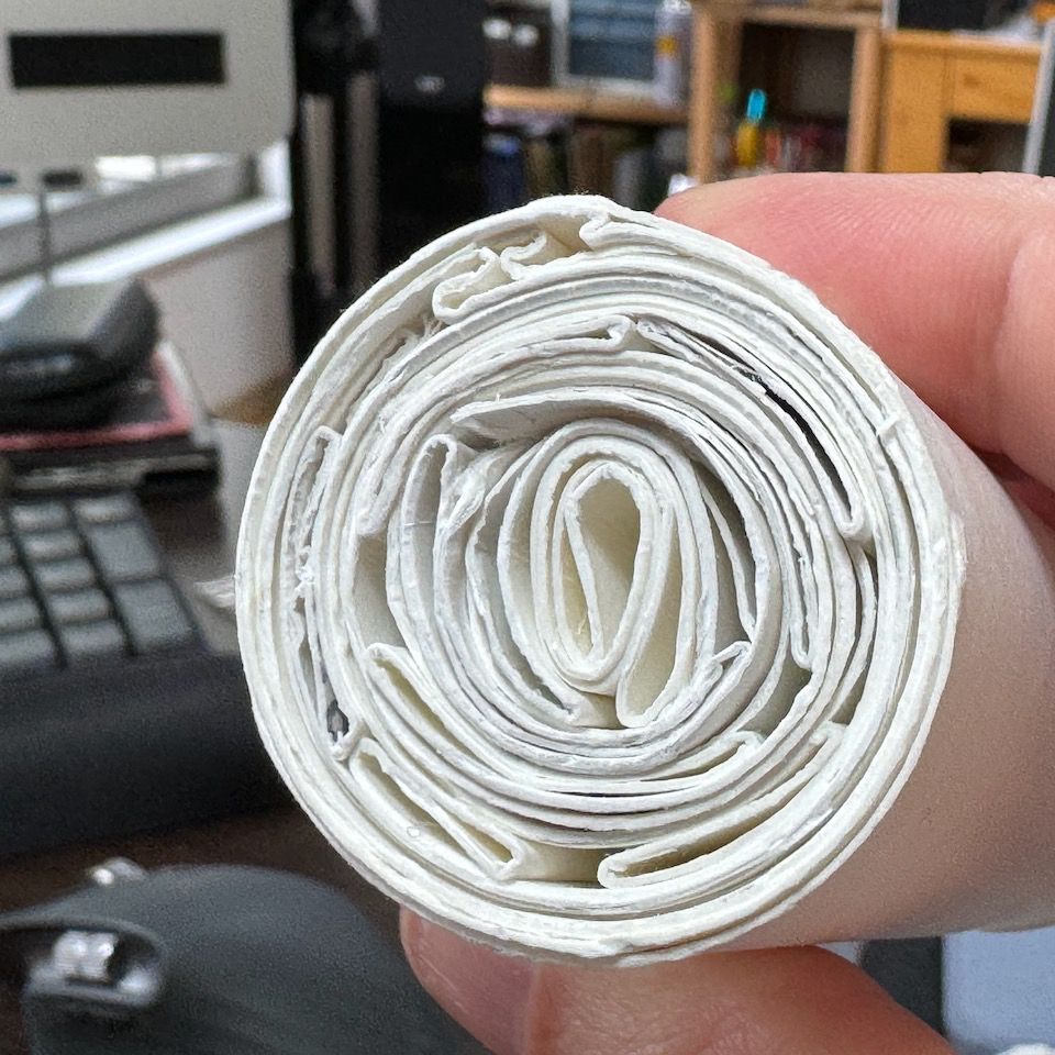 A toilet roll with 16 other toilet rolls fitted inside.