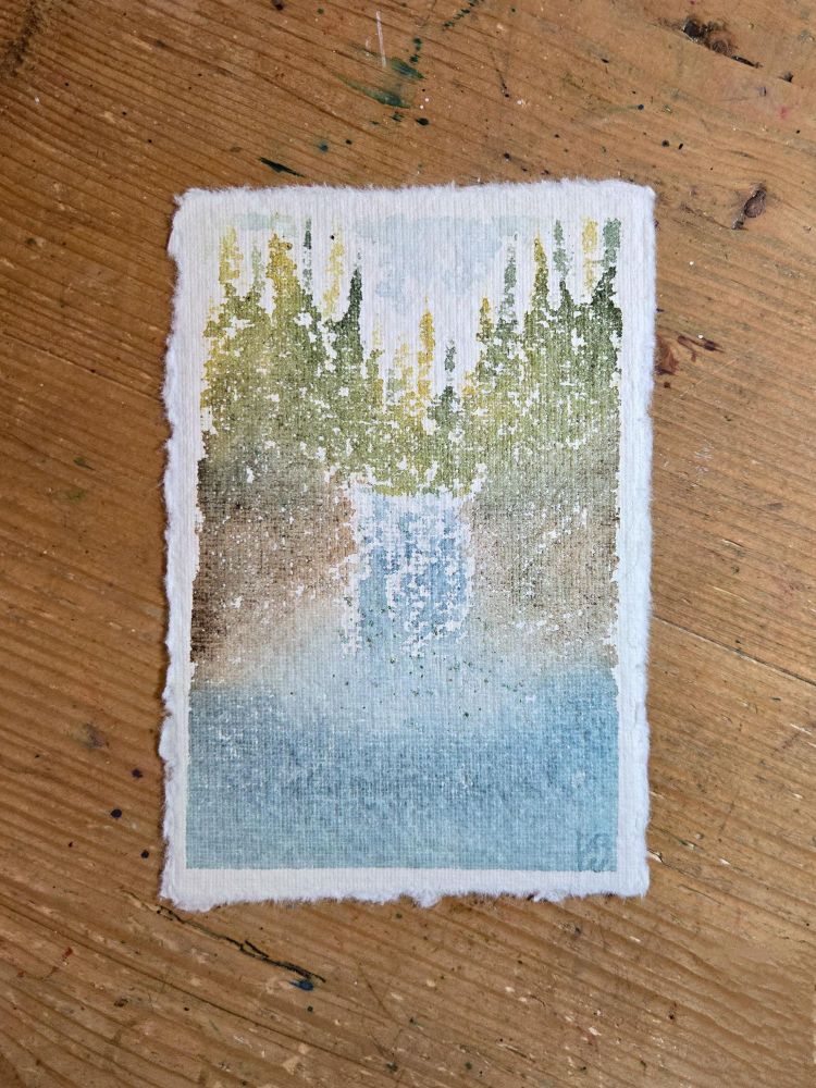 A watercolor painting on very textured paper of a waterfall. The waterfall is in the center of the painting and is flanked by brown rocks, above the waterfall are several pine trees, and the water is in the foreground. The colors are very muted as the pigments tend to fade on this type of paper. The painting is done in a very loose style.
