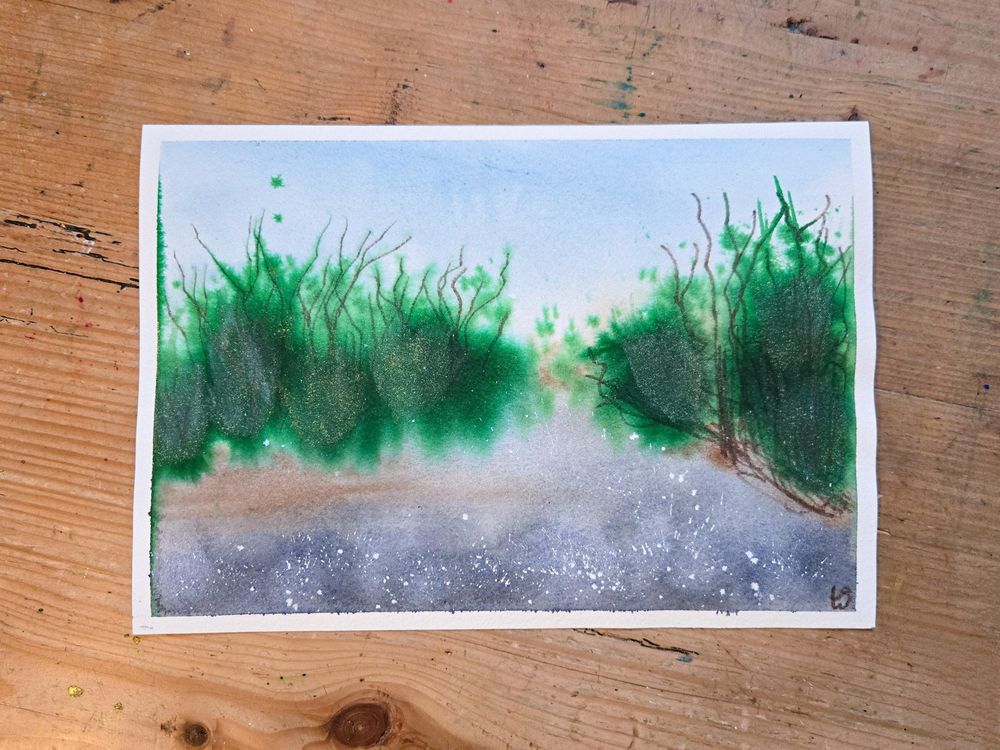 A watercolor abstract landscape painting. There is a blue sky, and a gray foreground that is inspired by a creek. There are also splashes of bright green ink in the center of the painting inspired by the signs of early spring. I used a brown watercolor pencil to draw branches shooting out from the green ink and twigs on the ground underneath.