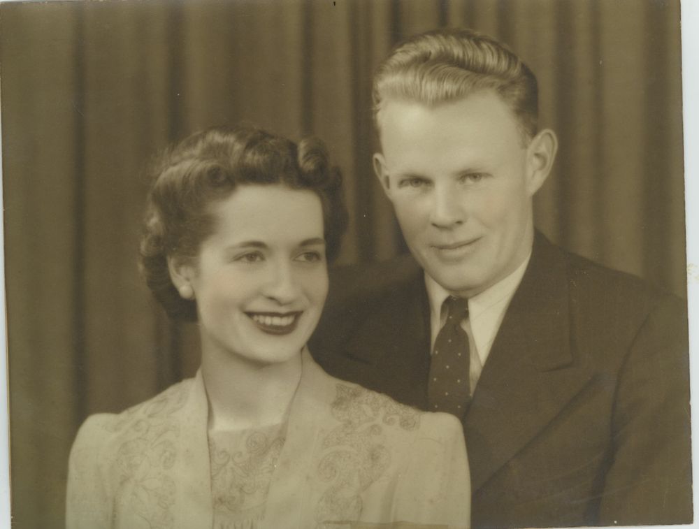 A black and white picture of a young couple.