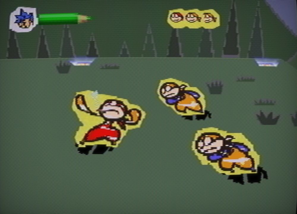 Three characters, two with goofy round glasses and baggy pants, surge toward another bandana sporting character leaning back to throw
