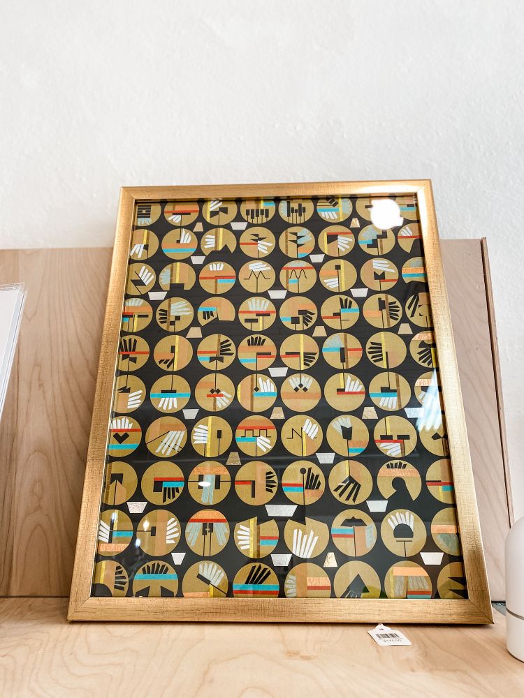 Mixed media framed artwork featuring bright graphic tape and line work