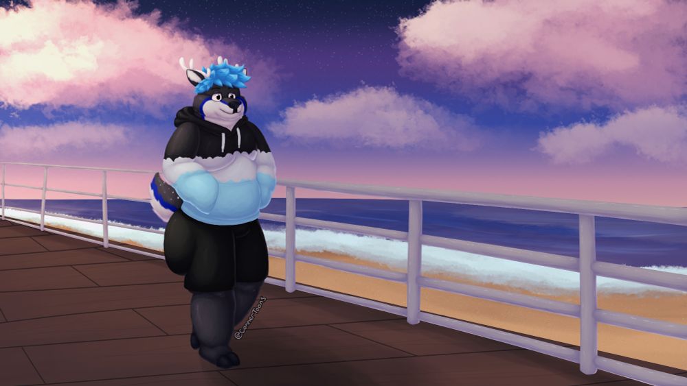 Conner walking down a boardwalk near a beach with a colorful sky in the horizon