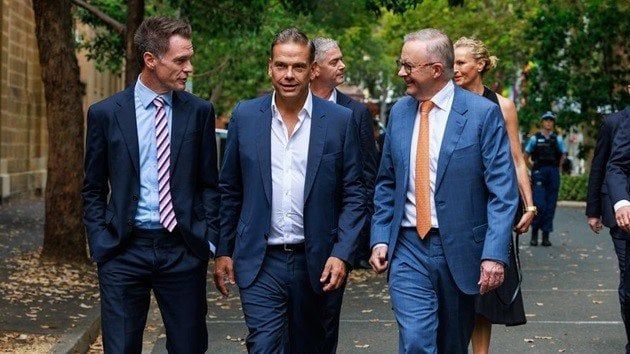 Australian Prime Minister looking overjoyed walking the streets with right wing NSW state premier, Chris Minns and ultra conservative MAGA Lachlan Murdoch.