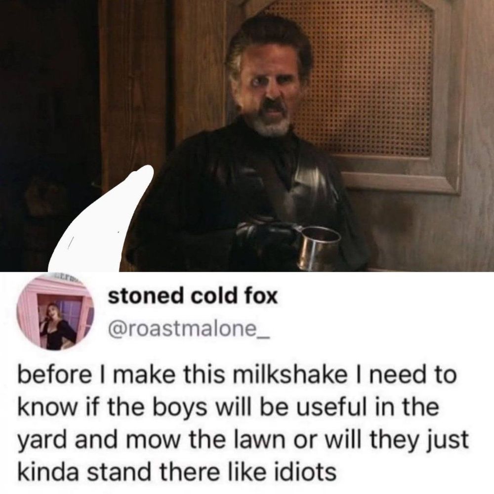 Izzy with a mug in his hand, leaning against a door looking grumpy/disgusted and a speech bubble containing a post that reads: before I make this milkshake I need to know if the boys will be useful in the yard and mow the lawn or will they just kinda stand there like idiots