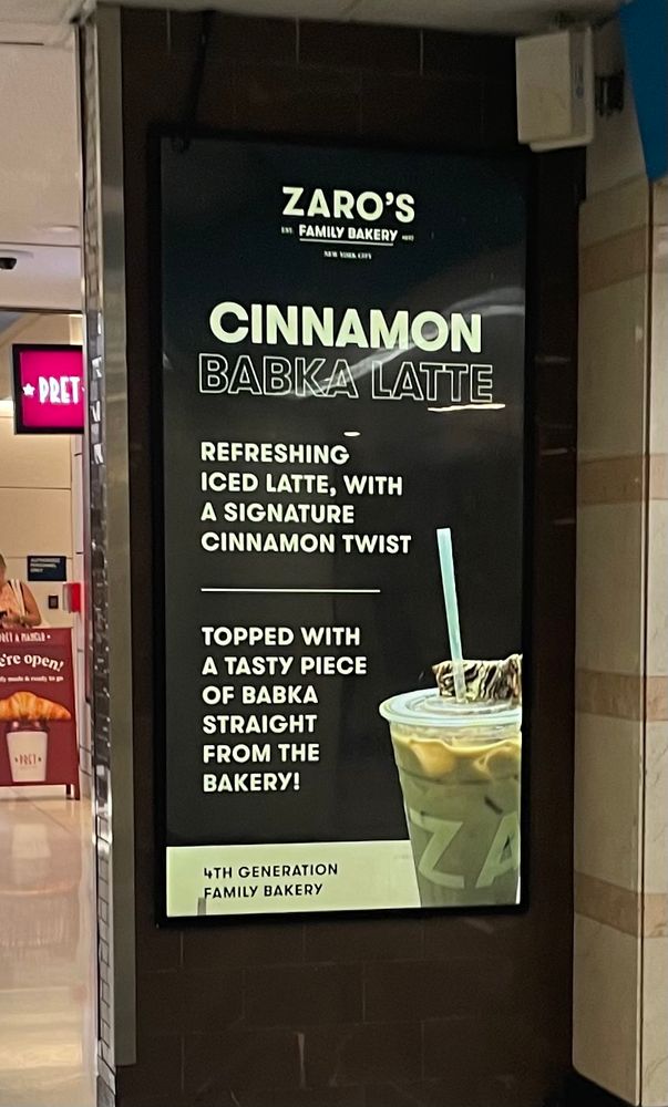 Ad for Zaro’s Bakery for a Cinnamon Babka Latte, a cinnamon latte with a piece  of babka on it.