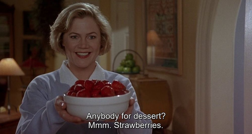 Beverly Sutphin offering up strawberries for dessert