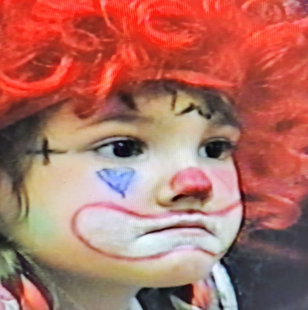 VHS footage of mari as a baby, dressed as a clown
